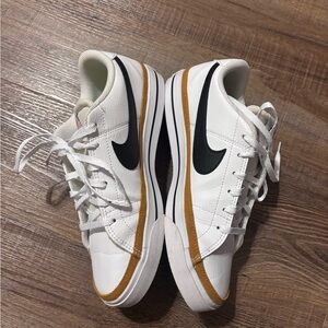 Nike White and Black Sneakers with Gold Accents